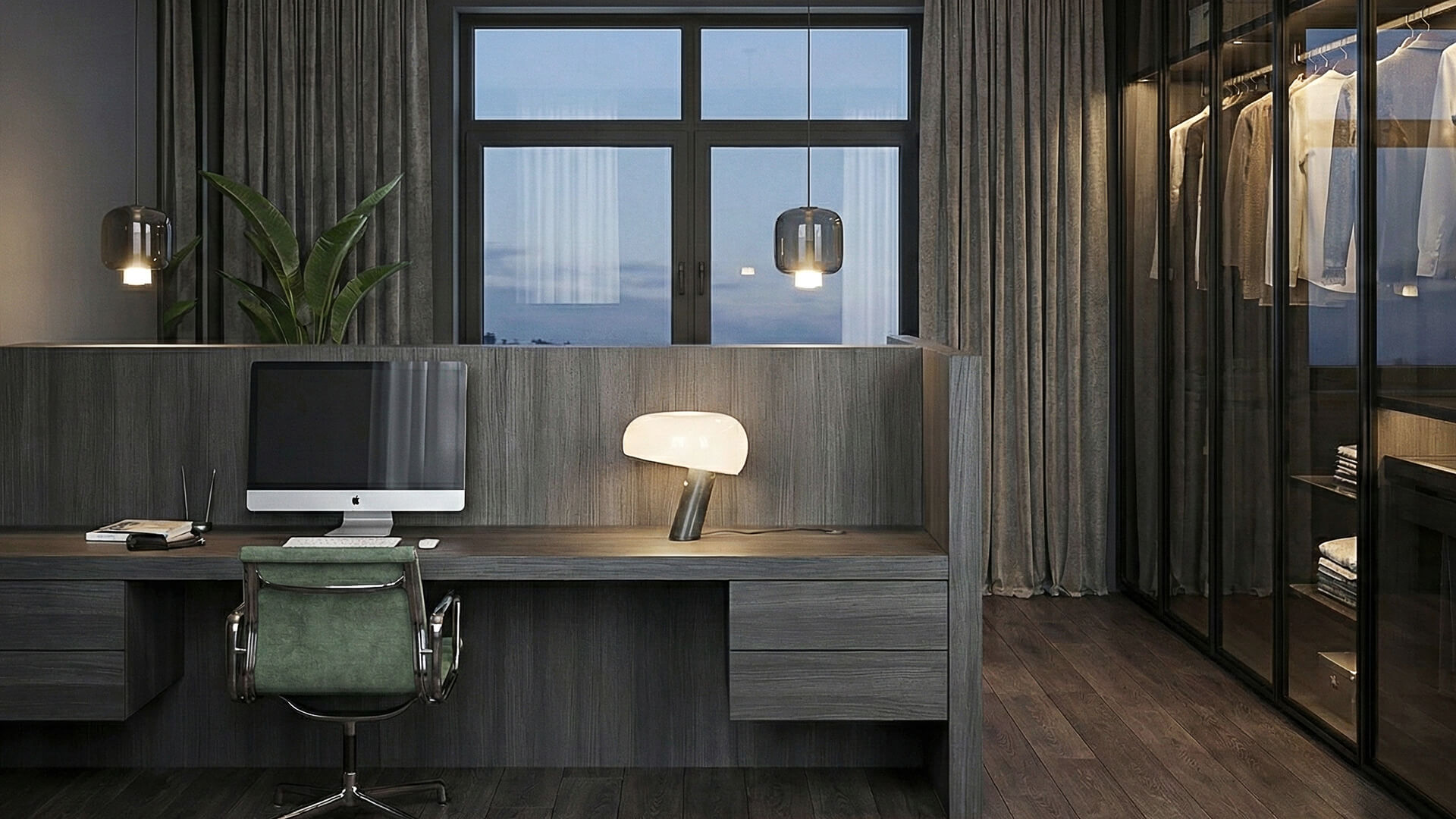 Scrivania in legno scuro con computer e lampada, lampade a sospensione e cabina armadio in vetro sul lato destro.